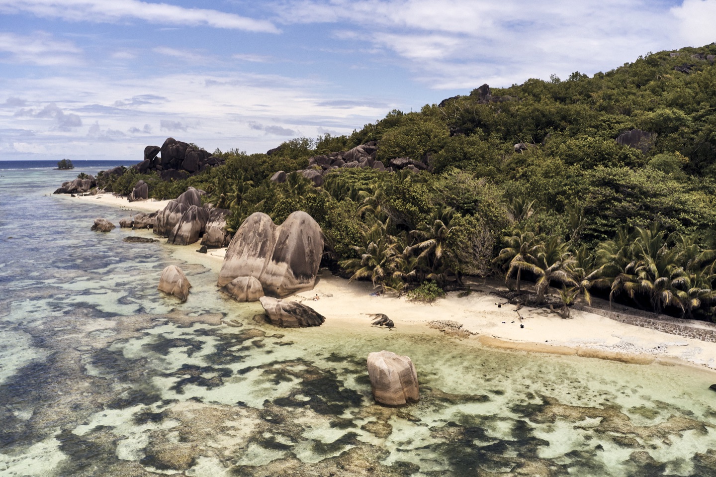 Aerial view of the Seychelles coastline and granite boulders